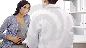 Gynecologist and pregnant woman at hospital