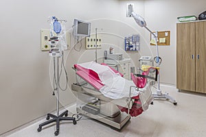 Gynecology in the clinic gynecology room, interior of the genicology clinic. Maternity chair in the surgical obstetric ward. Chair