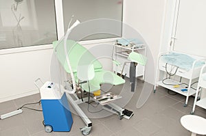 Gynecology equipment and chair in gynecology room photo