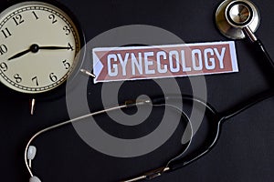 Gynecology on the paper with Healthcare Concept Inspiration. alarm clock, Black stethoscope.