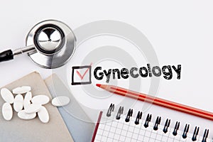 Gynecology. Questionnaire with red cross on the white paper