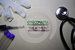 Gynecomastia Treatment text on Sticky Notes. Top view isolated on office desk. Healthcare/Medical concept
