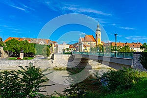 Gyor city with the Raba river and a carmelite church in Hungary