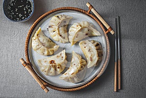 Gyoza Japanese korean dumplings on gray plate on the table. top view