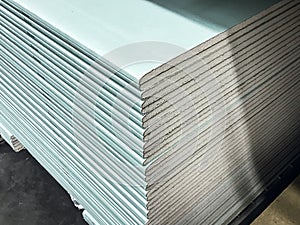 Gypsum board sheets in a stack