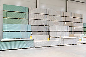 Gypsum board stacks at indoor warehouse