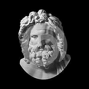 Gypsum copy of antique statue Zeus head isolated on black background. Plaster sculpture man face with beard.