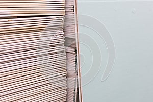 Gypsum plasterboard in the pack. The stack of gypsum board preparing for construction. Pallet with plasterboard in the building