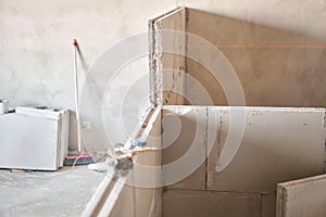 Gypsum plate. Construction of internal walls in the apartment using a plaster concrete plate with groove ridge. Saw in