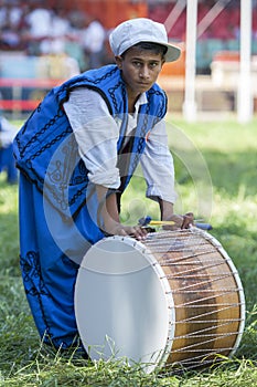 A gypsy drummer relaxes between performances at the Kirkpinar Turkish Oil Wrestling Festival in Edirne in Turkey.