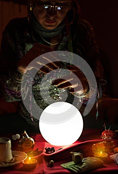 Gypsy fortune teller woman and crystal ball