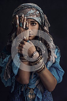 Gypsy style young woman wearing tribal jewellery portrait