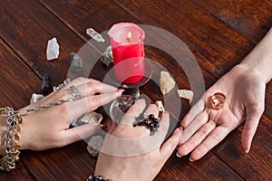 A Gypsy woman performs a love spell. A clairvoyant palmist reads by hand with a candle. A fortune teller predicts the fate of love