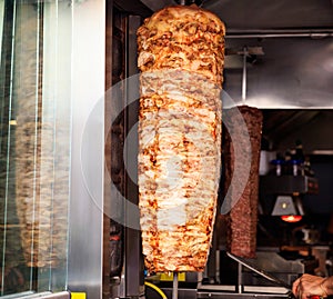 Gyro or doner roasted slowly on rotating spit. Close up view.