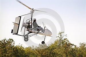 Gyrocopter in flight photo