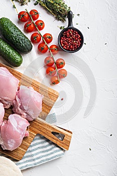 Gyros ingredients, raw chicken meat on white backgroundtop viewwith space for text