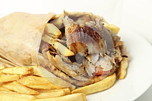 Gyros pita with french fries on dish