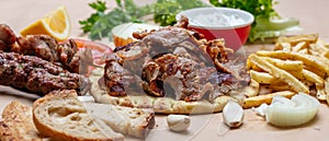 Gyros pita, Shawarma. Traditional greek, turkish meat food on pita bread and tzatziki, banner photo