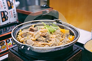 Gyudon, Japanese Simmered beef on the hotpot.