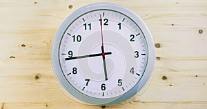 H24 hours timelapse seamless loop ready, clock hands movement, modern white metallic alarm wall clock on wood