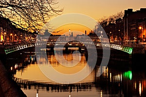 Ha`penny Bridge and the north banks of the river Liffey in Dublin City Centre at night