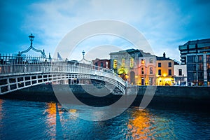 Ha`Penny Bridge over the River Liffey seen at dusk