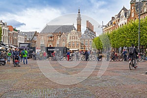 Haarlem/Holland - October 06 2019:  People walking and cycling in city center. Haarlem is the capital of the province of North