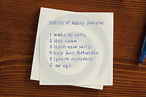 Habit of happy people written on note