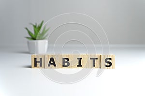 habits - word from wooden blocks with letters, Regular tendency or practice Routine, regularly acts concept photo