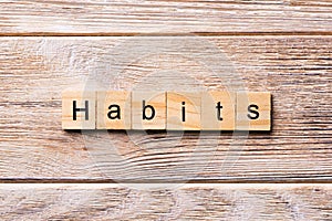 HABITS word written on wood block. HABITS text on wooden table for your desing, concept