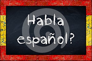 Habla espanol blackboard with spain flag frame