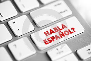 Habla Espanol? text button on keyboard, concept background