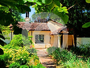 Hacienda style Mexican architecture building surrounded by lush garden