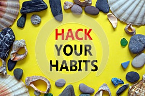 Hack your habits symbol. Words `Hack your habits` on a beautiful yellow background. Sea stones and seashells. Business, psycholo