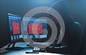Hacker with access denied messages on computer