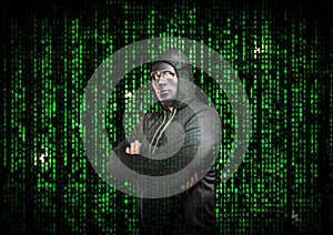 Hacker with arms crossed behind a mask