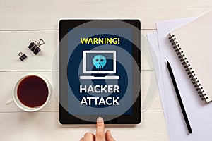 Hacker attack concept on tablet screen with office objects