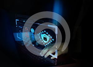 Hacker attack laptop computer with background icon binary, shield and padlock,concept preventing website attacks by keeping