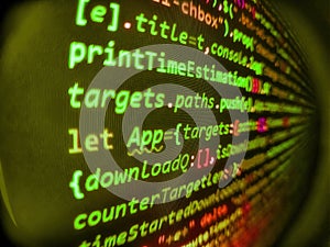 Hacker background. Abstract program code on computer screen. Computer script coding source code on desktop monitor. Digital