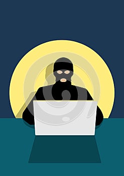Hacker behind laptop computer