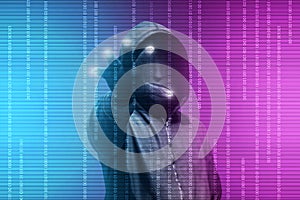 Hacker in black hoodie standing with open palms touch the digital binary code