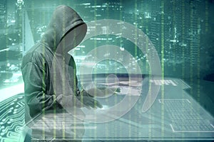 Hacker in black hoodie touching virtual screen on the table with server data, binary code, bar graph and world map
