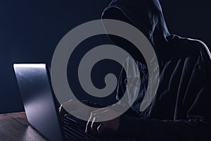 Hacker bypassing hardware firewall on laptop computer