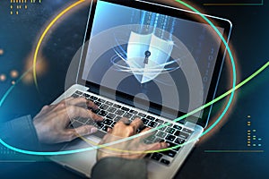 Hacker cracking the security code on a laptop