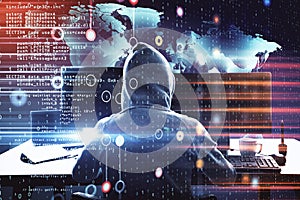 Hacker at desktop using computer and glowing world map