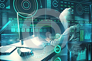 Hacker at desktop using computer