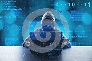Hacker at desktop using laptop with abstract glowing blue coding background. Binary code, theft, technology, data and internet