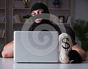 Hacker hacking computer late at night
