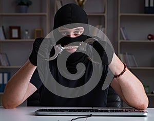 Hacker hacking computer late at night