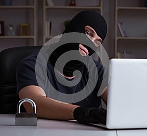 Hacker hacking computer late at night